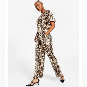 363. Women’s Animal-Print Flutter-Sleeve Jumpsuit.